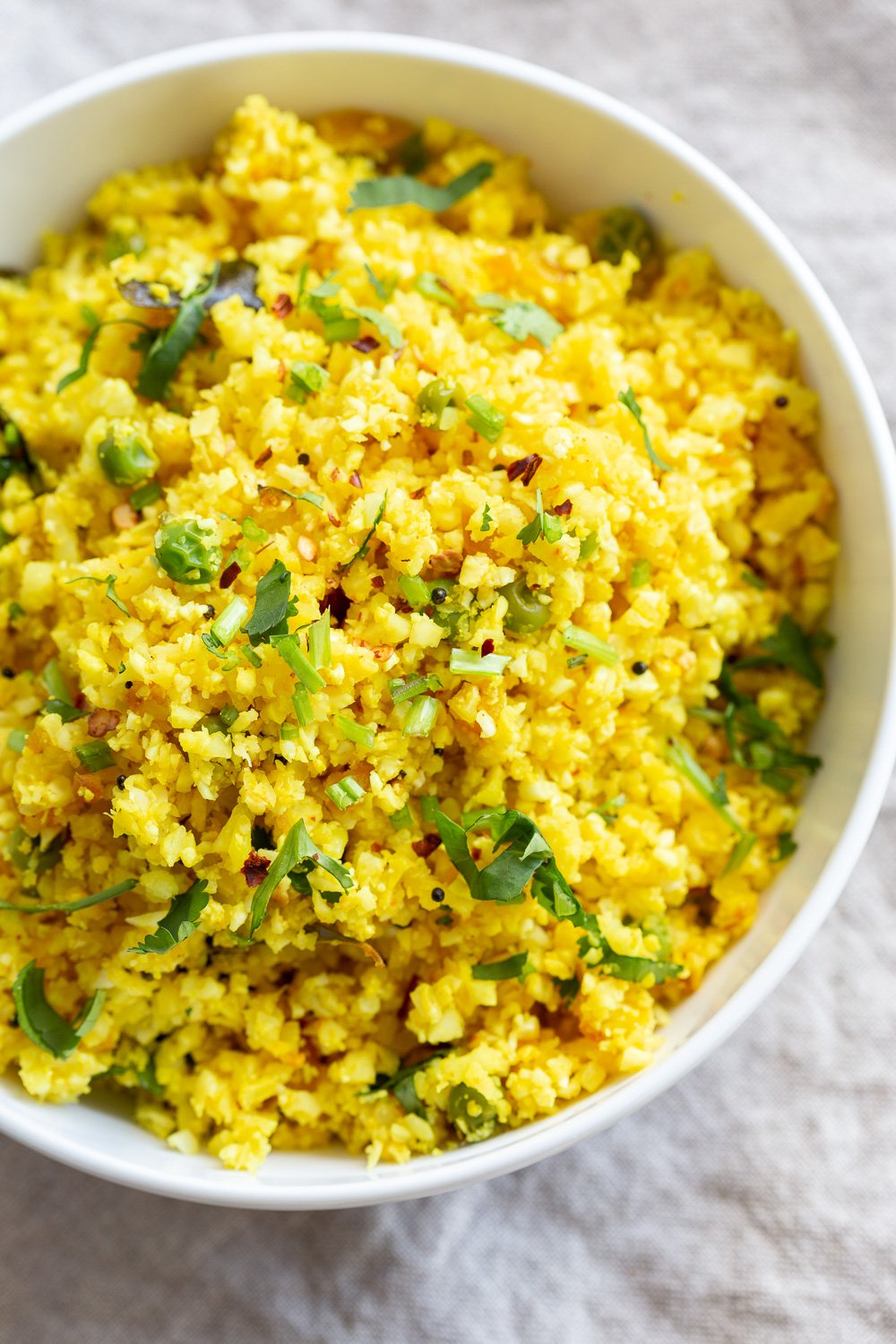 Lemony Turmeric Cauliflower Rice. Easy Side with any meal. 1 Pot 15 Minute Lemon Cauliflower Rice with mustard seeds and garlic. #Vegan #Glutenfree #Grainfree #Nutfree #Recipe #Turmeric #cauliflowerrice #veganrucha