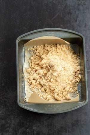 Crust for our Vegan Apple Custard Squares in a lined brownie pan