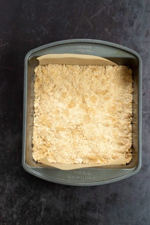 Crust for our Vegan Apple Custard Squares in a lined brownie pan