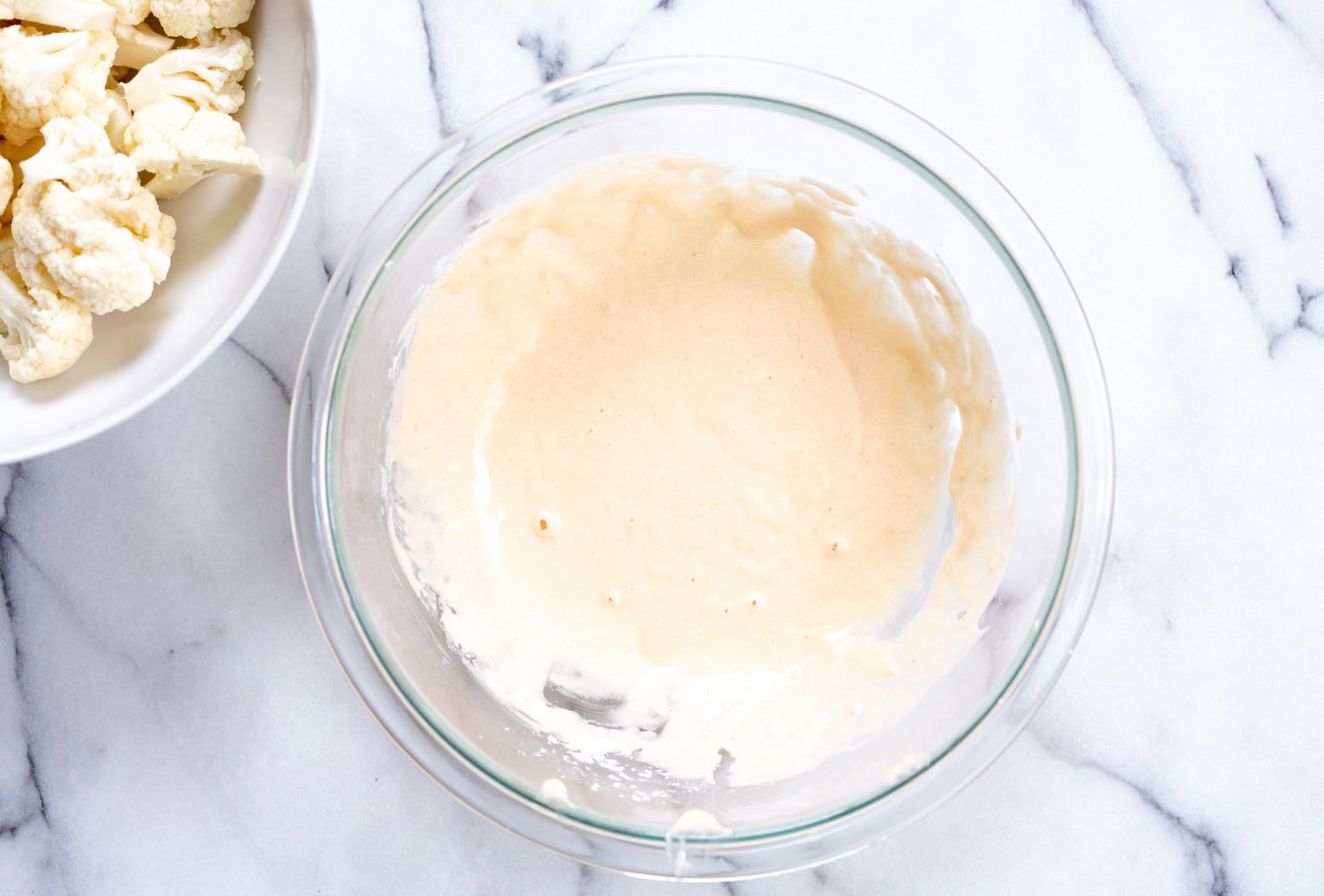 Batter in a white bowl for our Vegan Nashville Hot Cauliflower Wings
