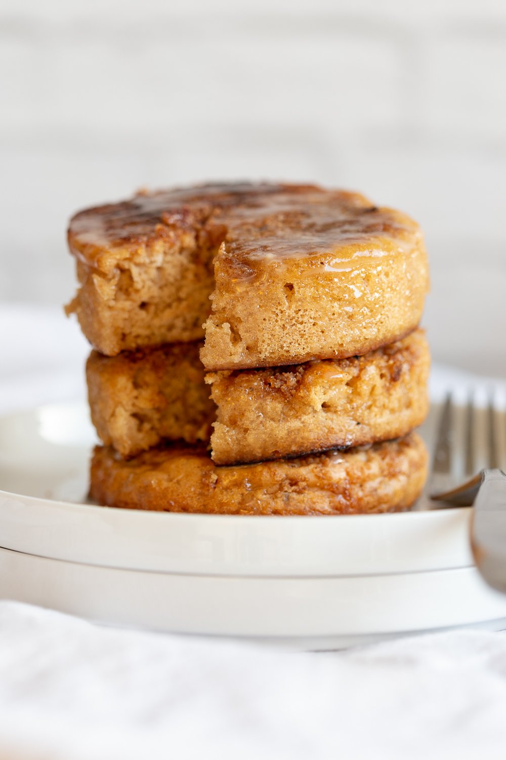 Vegan Cinnamon Streusel Pancakes tower on a white plate