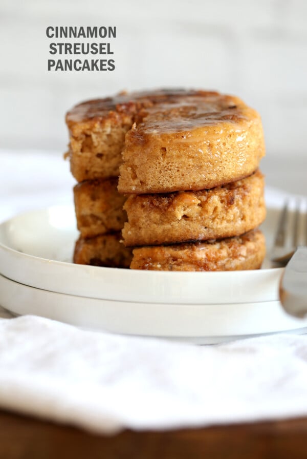 These Vegan Cinnamon Streusel Pancakes are a perfect treat for Valentines or a special day. A delicious fluffy vanilla pancake topped with a cinnamon streusel for a coffee cake like pancake. Make the pancakes in cookie cutters to make a cake like pancake tower! #Vegan #Pancakes #Soyfree #Nutfree #Recipe #VeganRicha