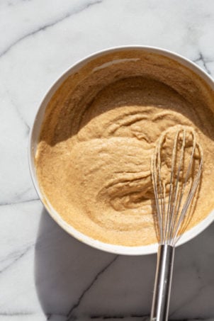 Our Vegan Gluten free Vanilla Cake batter in a white bowl