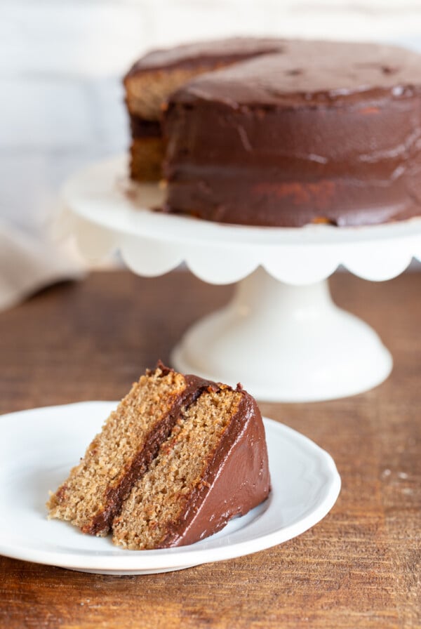 The Best Vegan Gluten free Vanilla Cake with Chocolate Frosting. Soft and delicious vanilla cakes sweetened with dates. Vegan Gluten free Recipe. Can be refined sugar free.Â
