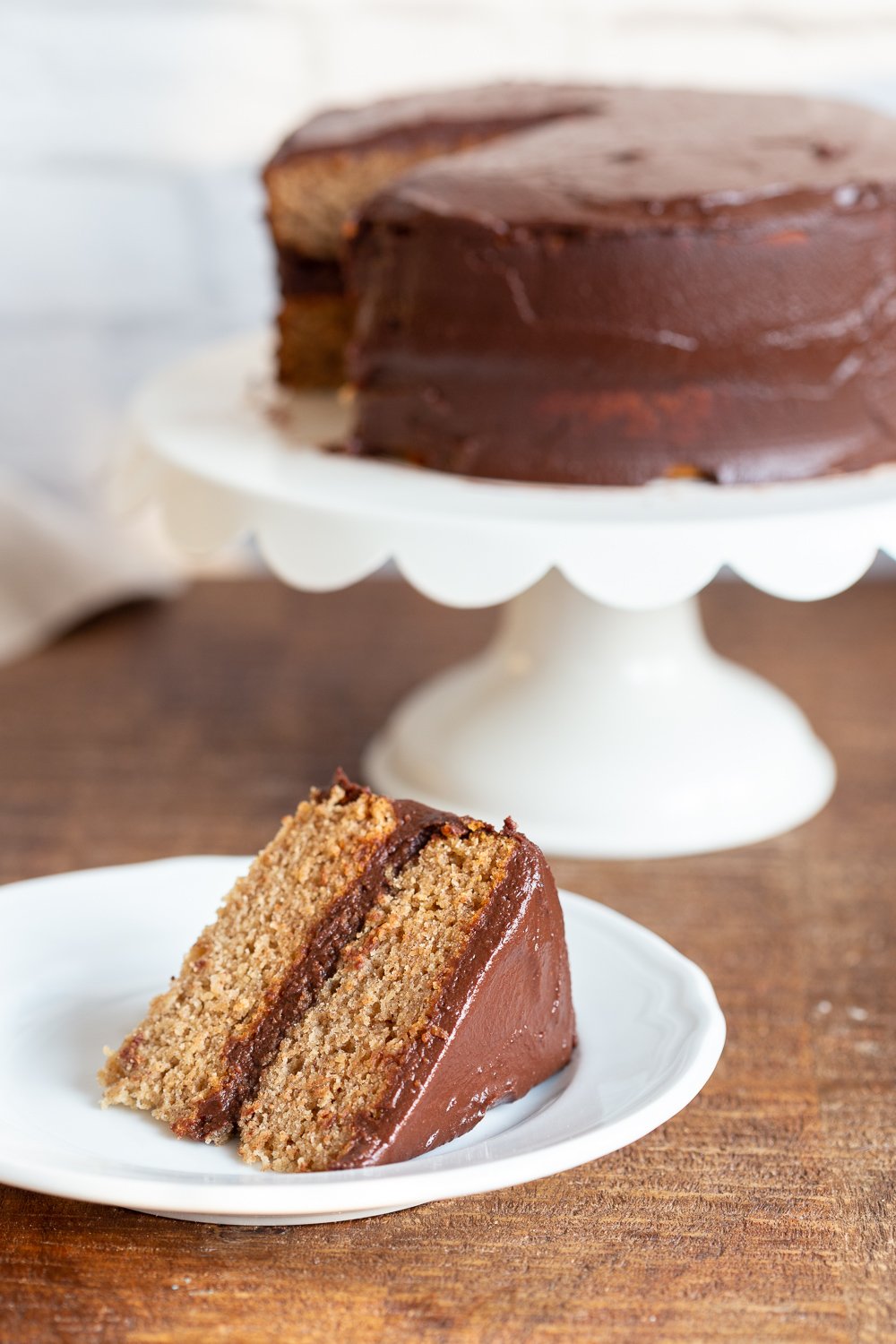 The Best Vegan Gluten free Vanilla Cake with Chocolate Frosting. Soft and delicious Vanilla cakes sweetened with dates. #Vegan #Glutenfree #vanillacake #Recipe #veganRicha Can be #refinedsugarfree.