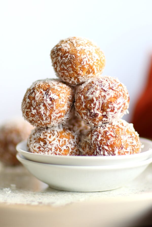 Easy Vegan Carrot Cake Bites Recipe! These Spiced Nut and Carrot Cake Balls Need just 8 ingredients and 15 minutes. Grainfree Carrot Cake Bliss Balls. Roll in coconut or dress with vegan cream cheese glaze. #CarrotCakeBites #Vegan #Glutenfree #Grainfree #Soyfree #healthy #VeganRicha VeganRicha.com