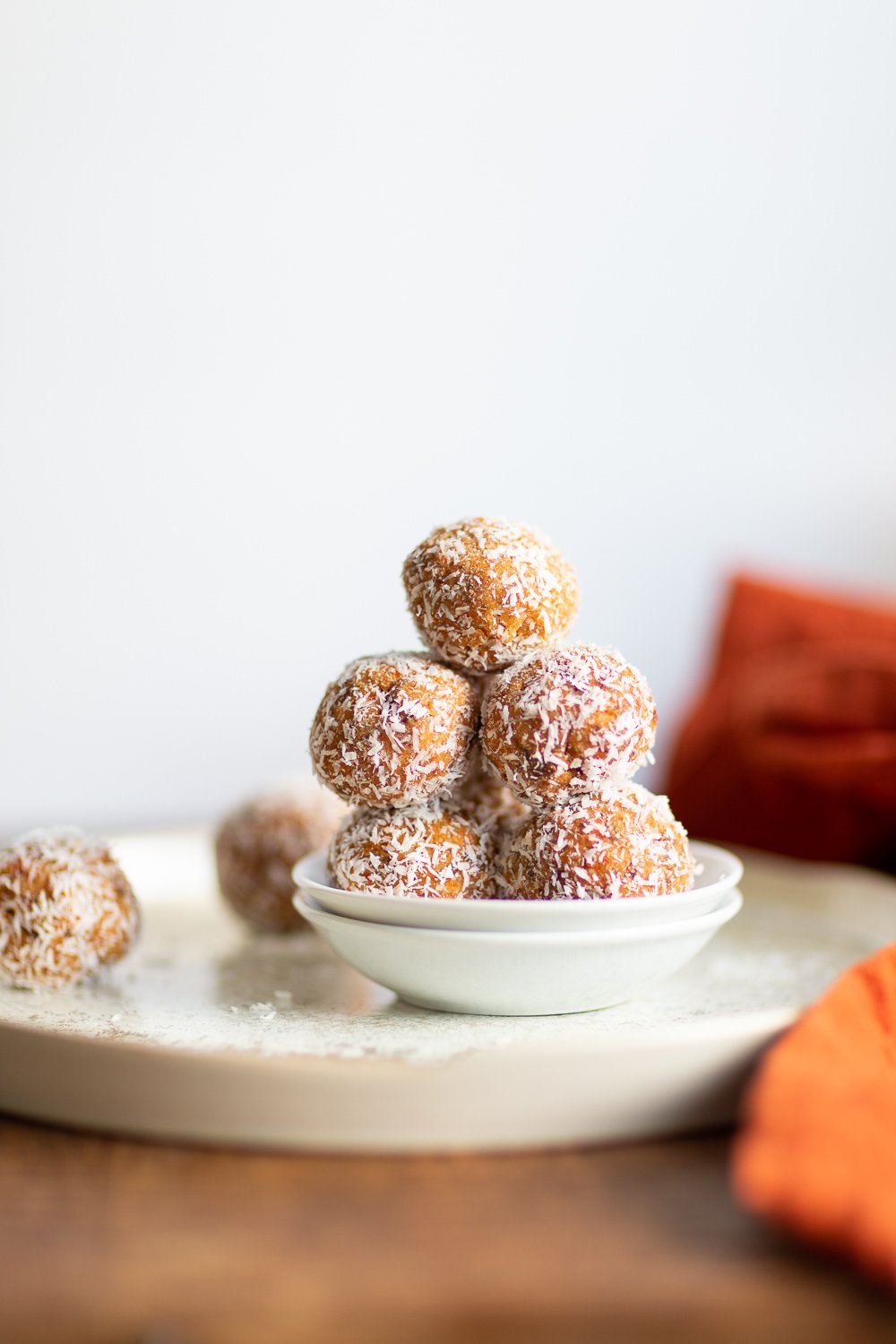 Easy Vegan Carrot Cake Bites Recipe! These Spiced Nut and Carrot Cake Balls Need just 8 ingredients and 15 minutes. Grainfree Carrot Cake Bliss Balls. Roll in coconut or dress with vegan cream cheese glaze. #CarrotCakeBites #Vegan #Glutenfree #Grainfree #Soyfree #healthy #VeganRicha VeganRicha.com