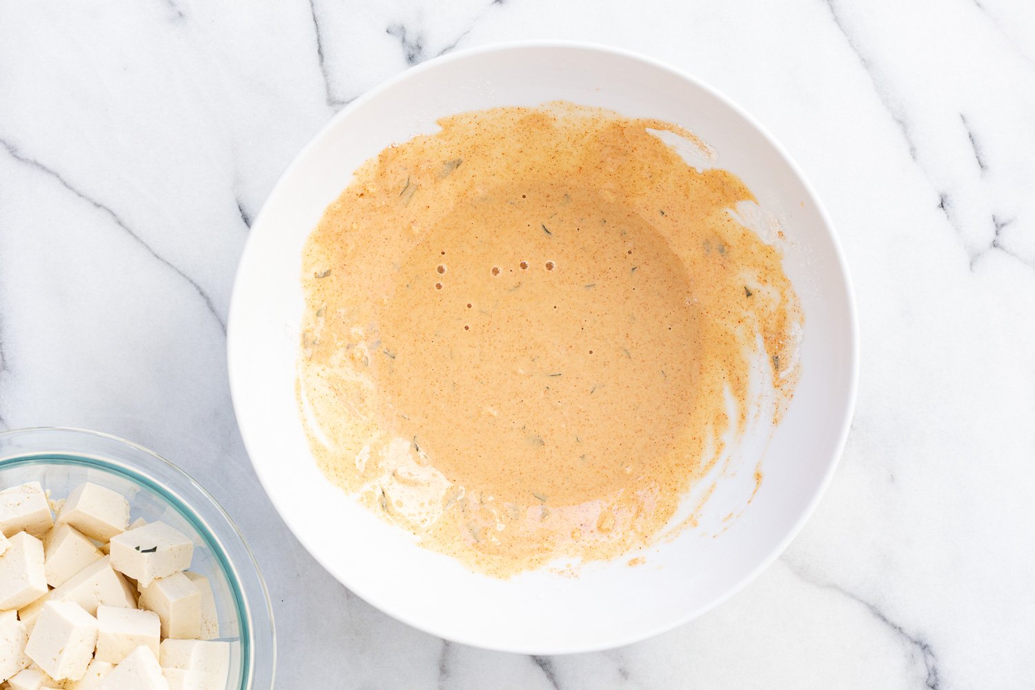Batter for our Tofu 65 in a white bowl