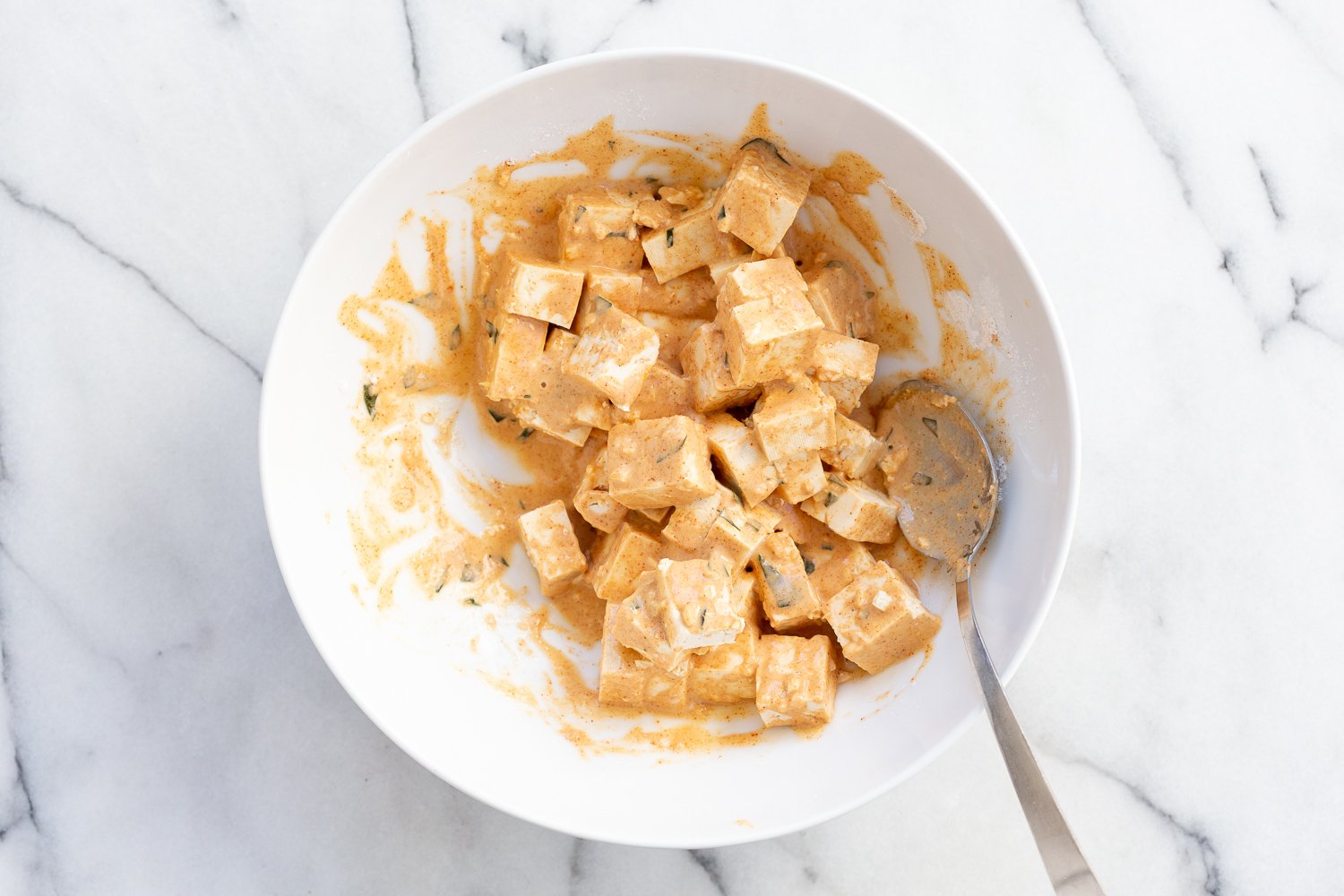 Battered Tofu for our Tofu 65 in a white bowl