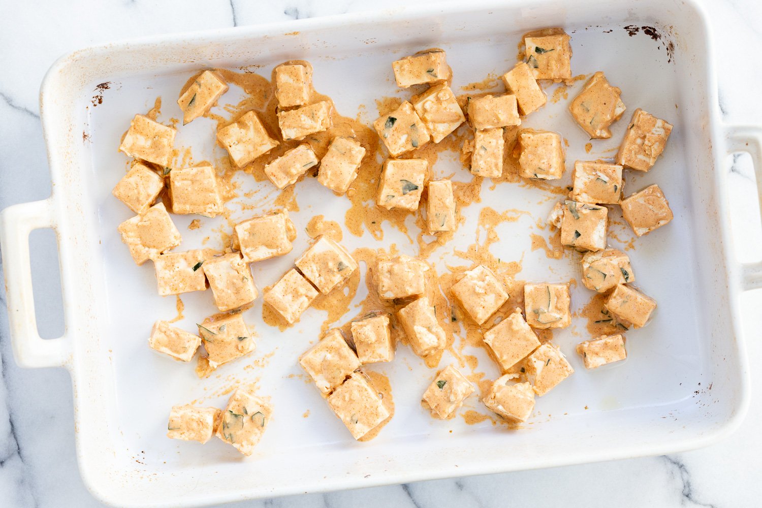 Battered Tofu for our Tofu 65 in a white bowl