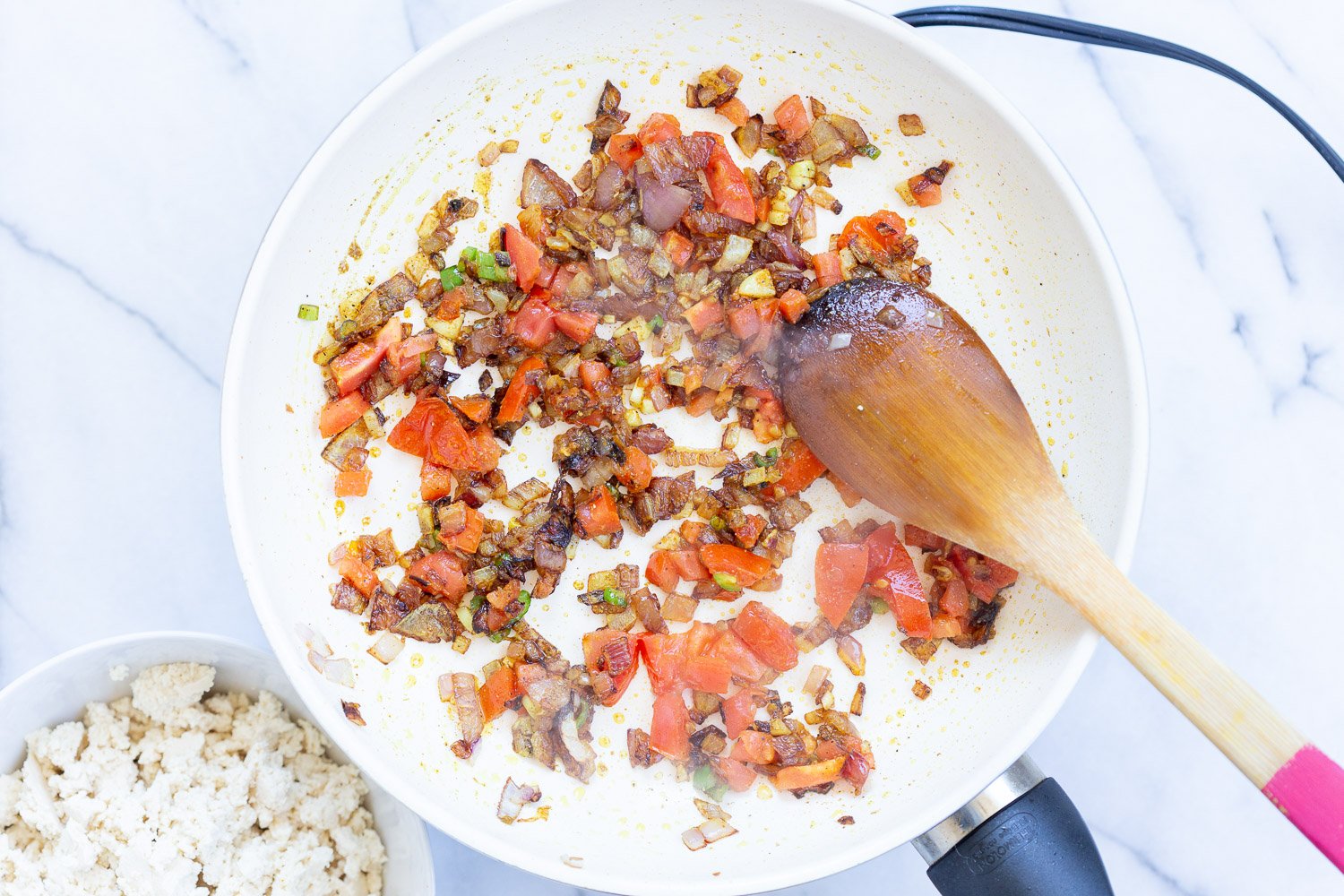 Ingredients for our Vegan Tofu Bhurji in a white skillet