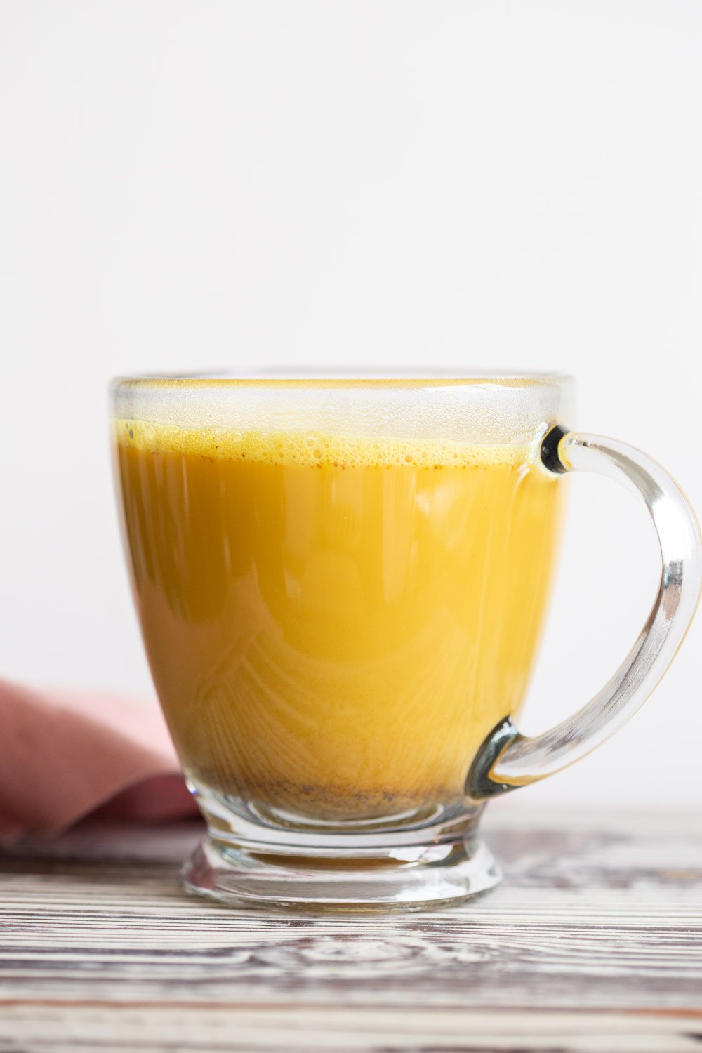 Golden Chai Latte made with our Golden Chai Mix in a glass container