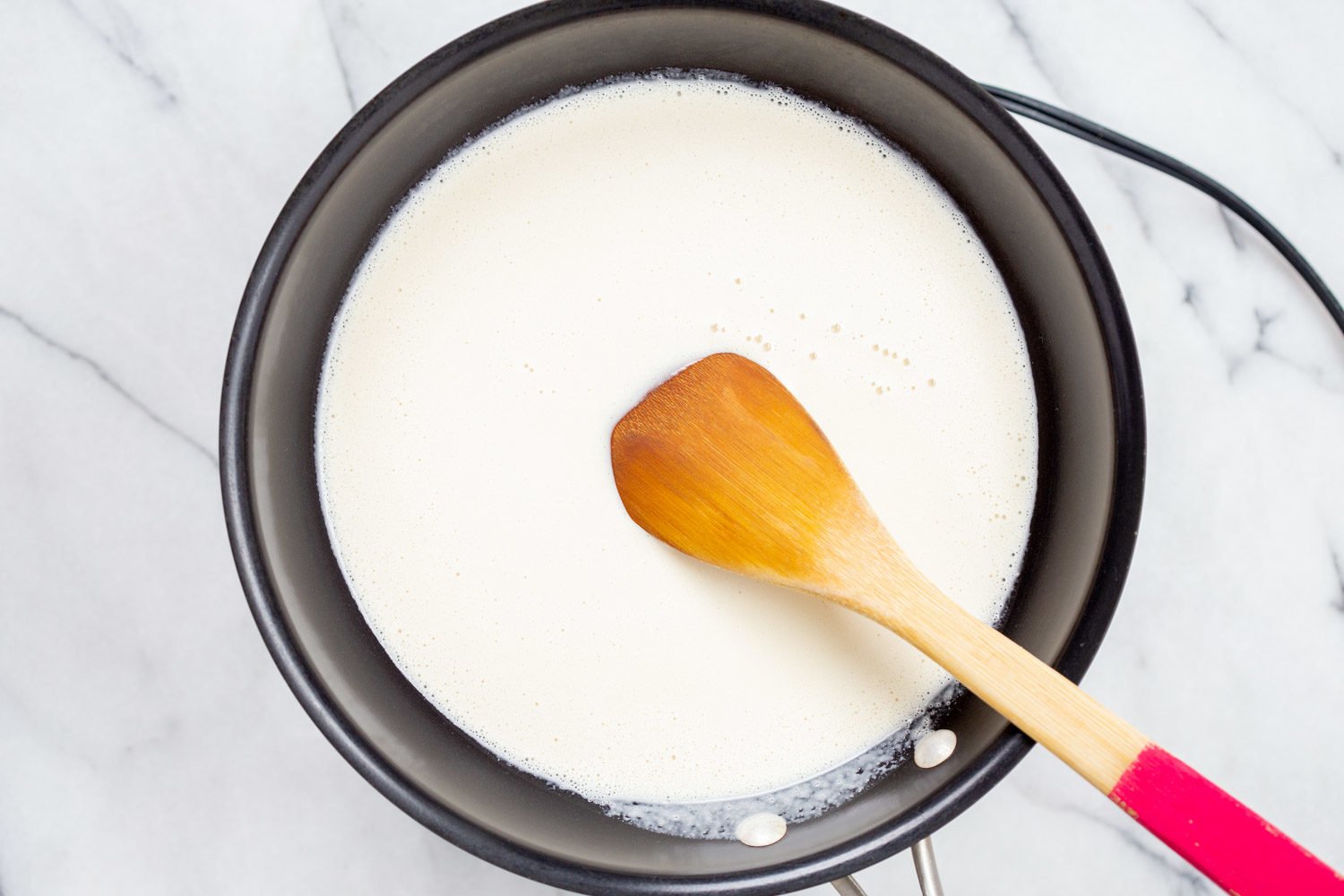 Cashew Mozzarella in skillet for our vegan Margherita pizza