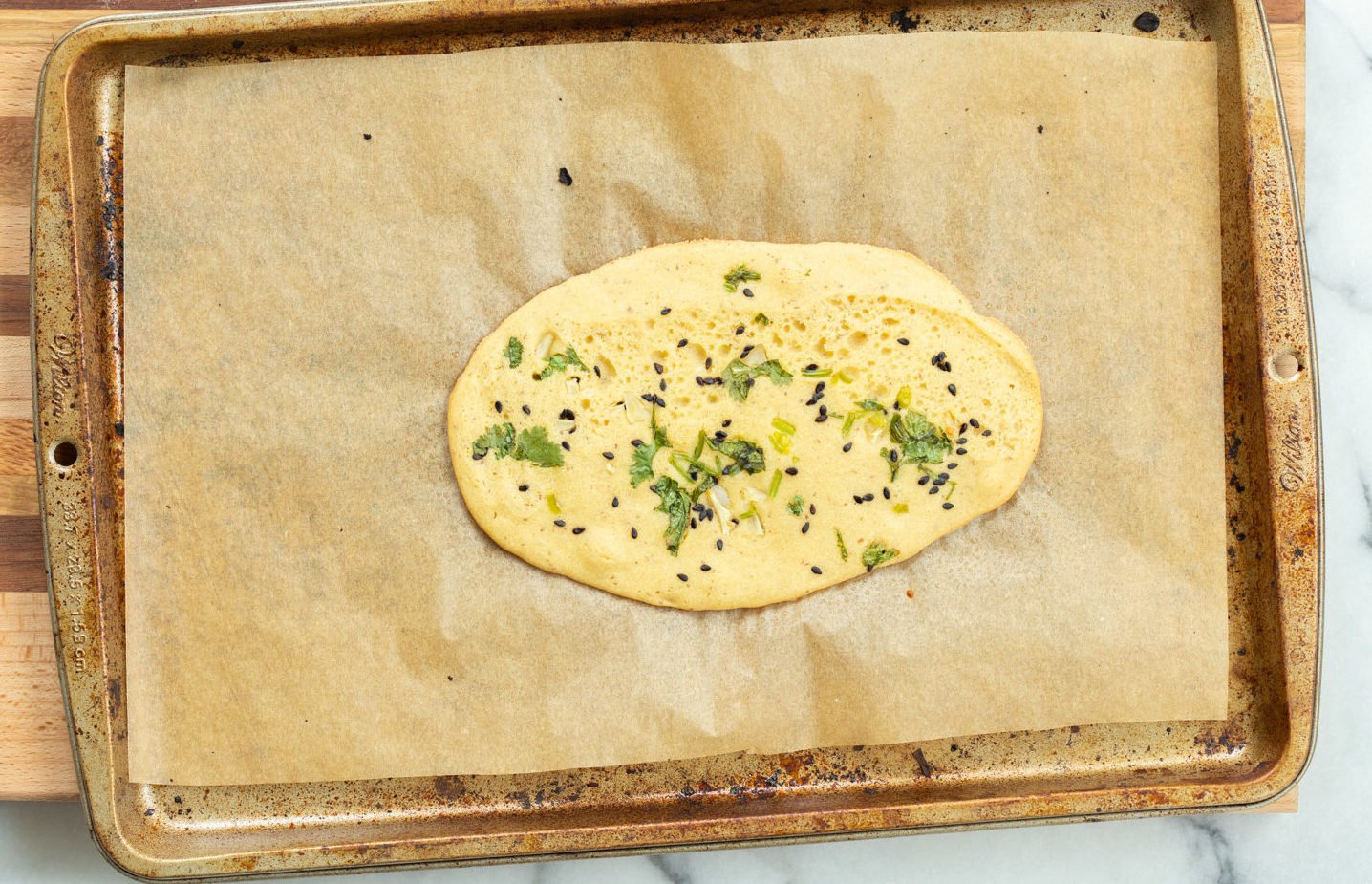 Vegan Gluten Free Naan on parchment lined baking sheet