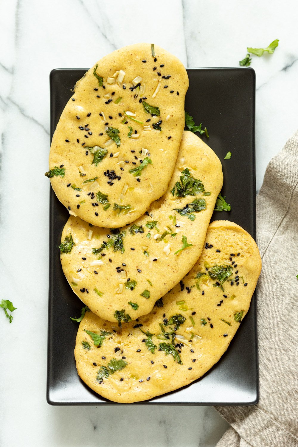 Vegan Gluten free Naan Flatbread. Grain-free Naan Recipe. 6 Main Ingredients,  1 Bowl, and 20 Minutes. Serve with curries or slice and serve with dips or add to bowls. Soyfree Nutfree options #Vegan #Glutenfree #grainfree #Veganricha #glutenfreenaan #grainfreenaan #chickpeaflournaan