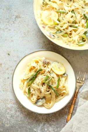 Vegan Lemon Asparagus Pasta - 30 mins! Creamy Lemon Alfredo style sauce with tofu with fettuccine and pan roasted garlic asparagus and more lemon. #Vegan #Nutfree #Recipe. Can be Glutenfree #VeganRicha #LemonAsparagusPasta 17 gm of protein