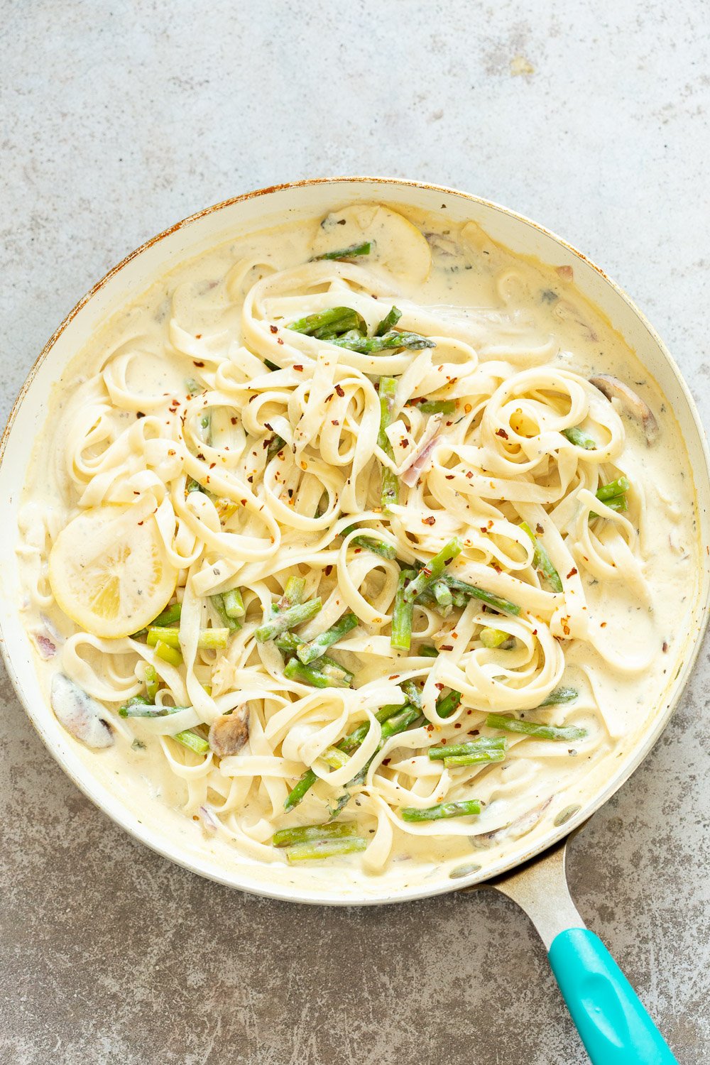 Pasta tossed with Lemon Cream Sauce for our Vegan Lemon Asparagus Pasta