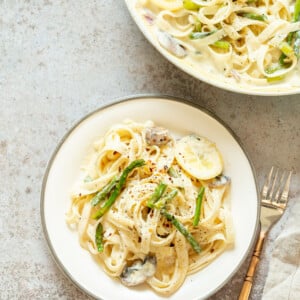 Vegan Lemon Asparagus Pasta - 30 mins! Creamy Lemon Alfredo style sauce with tofu with fettuccine and pan roasted garlic asparagus and more lemon. #Vegan #Nutfree #Recipe. Can be Glutenfree #VeganRicha #LemonAsparagusPasta 17 gm of protein