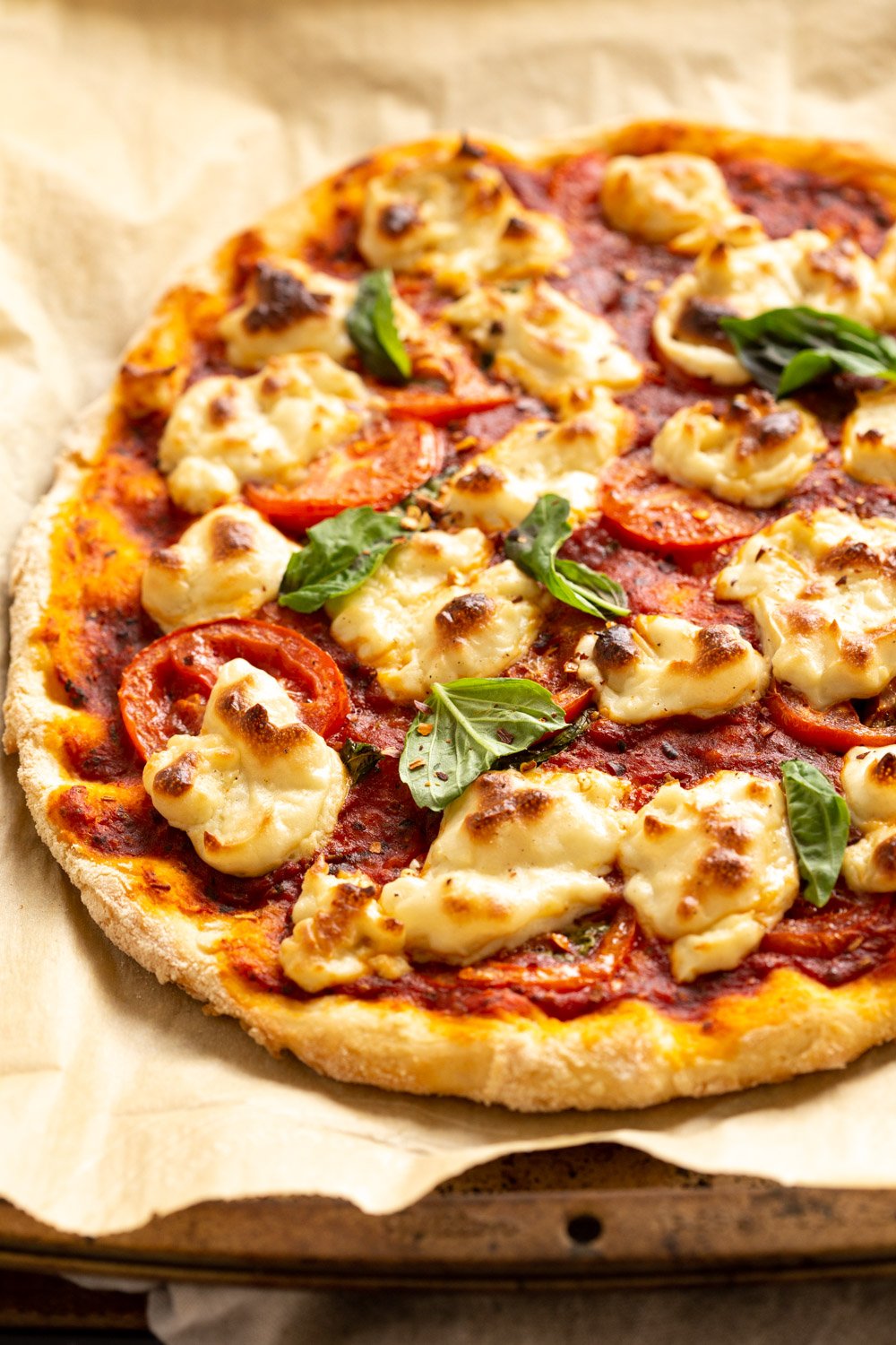 Our Vegan Margherita Pizza on parchment