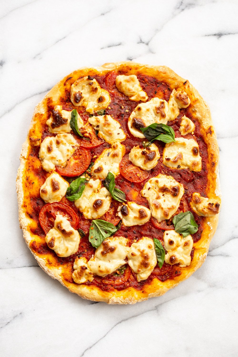 Our Vegan Margherita Pizza on marble