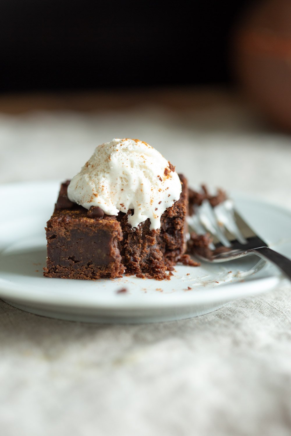 Slice of our Vegan Chickpea Brownies on a white plate