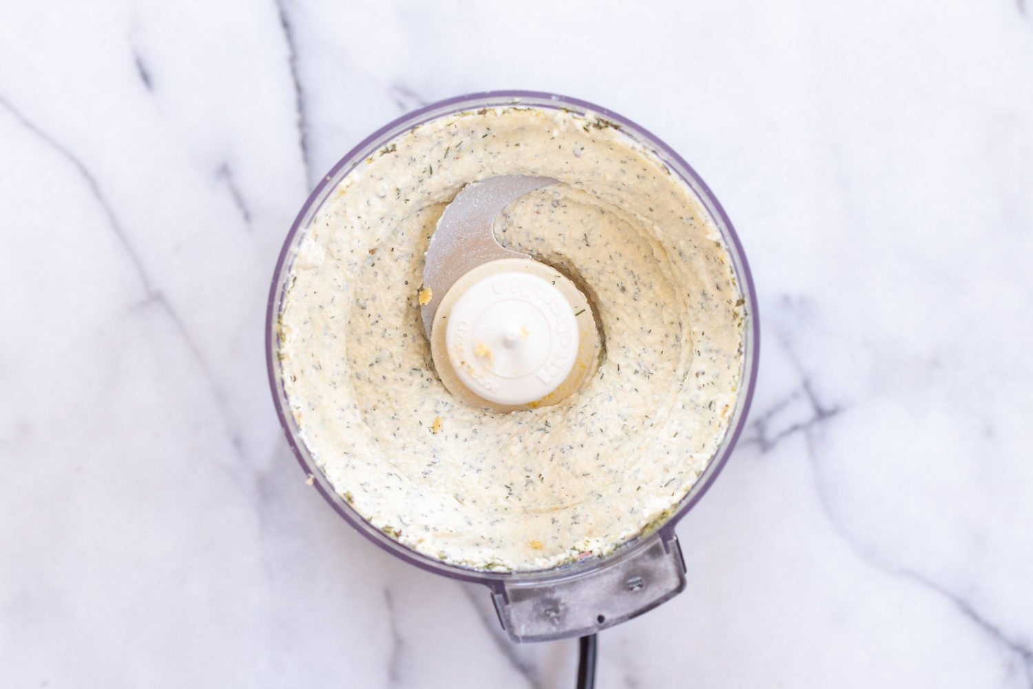 Dairy free herbed cream cheese blended in a food processor, for our Vegan Tortilla Roll ups recipe