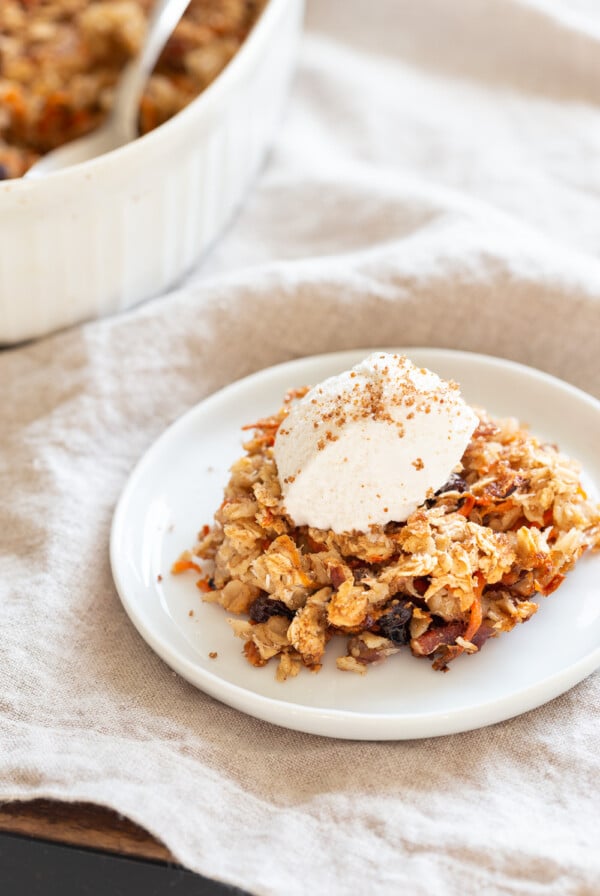 This Vegan Carrot Cake Baked Oatmeal has roasted carrots,, spices, nuts, dates and Oats! Crisp on the outside and spiced, delicious carrot cake like inside.  #Vegan #Soyfree #Recipe #VeganRicha #carrotcakeoatmeal #carrotcakebakedoatmeal Easily nutfree, #glutenfree