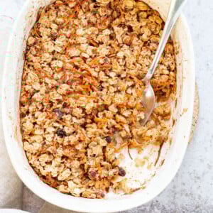 This Vegan Carrot Cake Baked Oatmeal has roasted carrots,, spices, nuts, dates and Oats! Crisp on the outside and spiced, delicious carrot cake like inside.  #Vegan #Soyfree #Recipe #VeganRicha #carrotcakeoatmeal #carrotcakebakedoatmeal Easily nutfree, #glutenfree