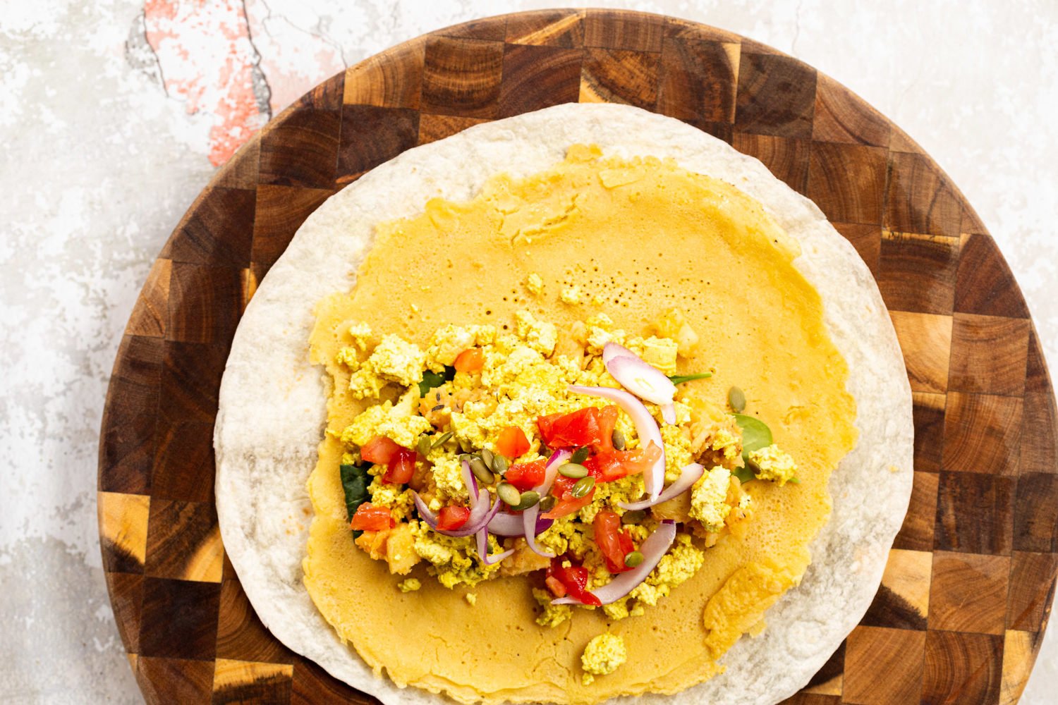 Vegan Breakfast Burrito with 5 Ingredient Tofu Scramble, Breakfast potatoes, chickpea pancake, tomatoes, pepitas and salsa! High protein breakfast burrito or tacos. Nutfree Recipe. Can be Gluten-free, Soyfree.