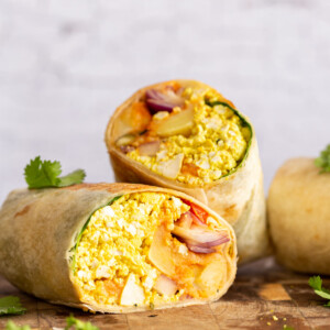 Vegan Breakfast Burrito with 5 Ingredient Tofu Scramble, Breakfast potatoes, chickpea pancake, tomatoes, pepitas and salsa! High protein breakfast burrito or tacos. Nutfree Recipe. Can be Gluten-free, Soyfree.