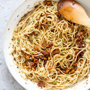 Our Vegan Cacio De Pepe with Smoky Chickpea Tofu Bits in a while skillet
