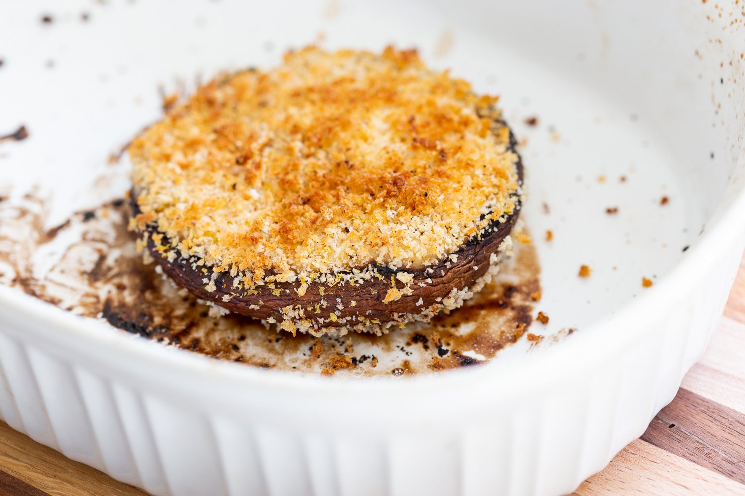 Breaded Stuffed Portobello in a bakisg dish for our Vegan Portobello Mushroom Burger