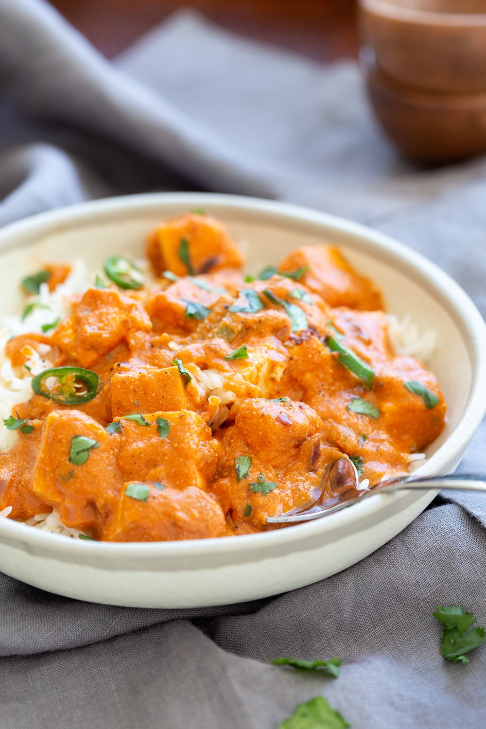 Vegan Paneer Lababdar with rice in a white bowl