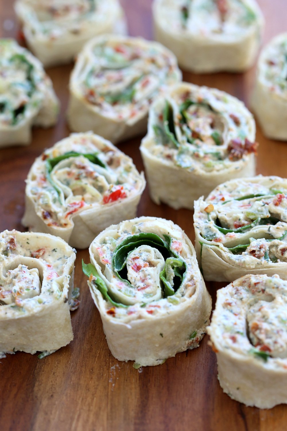 Vegan Tortilla Roll Ups Recipe. Veggies and Sun-dried tomato are mixed in Tofu Herb Cream Cheese androlled to make Easy Tortilla pinwheels. Vegan Nutfree Recipe, can be gluten-free soy-free #Oilfree #Daoryfree #Vegan #veganricha #tortillarollups #sundriedtotmatopinwheels