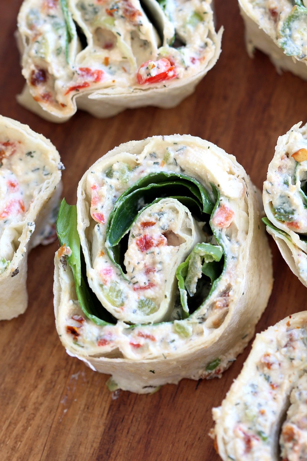 Vegan Tortilla Roll Ups Recipe. Veggies and Sun-dried tomato are mixed in Tofu Herb Cream Cheese androlled to make Easy Tortilla pinwheels. Vegan Nutfree Recipe, can be gluten-free soy-free #Vegan#veganricha #tortillarollups #sundriedtotmatopinwheels