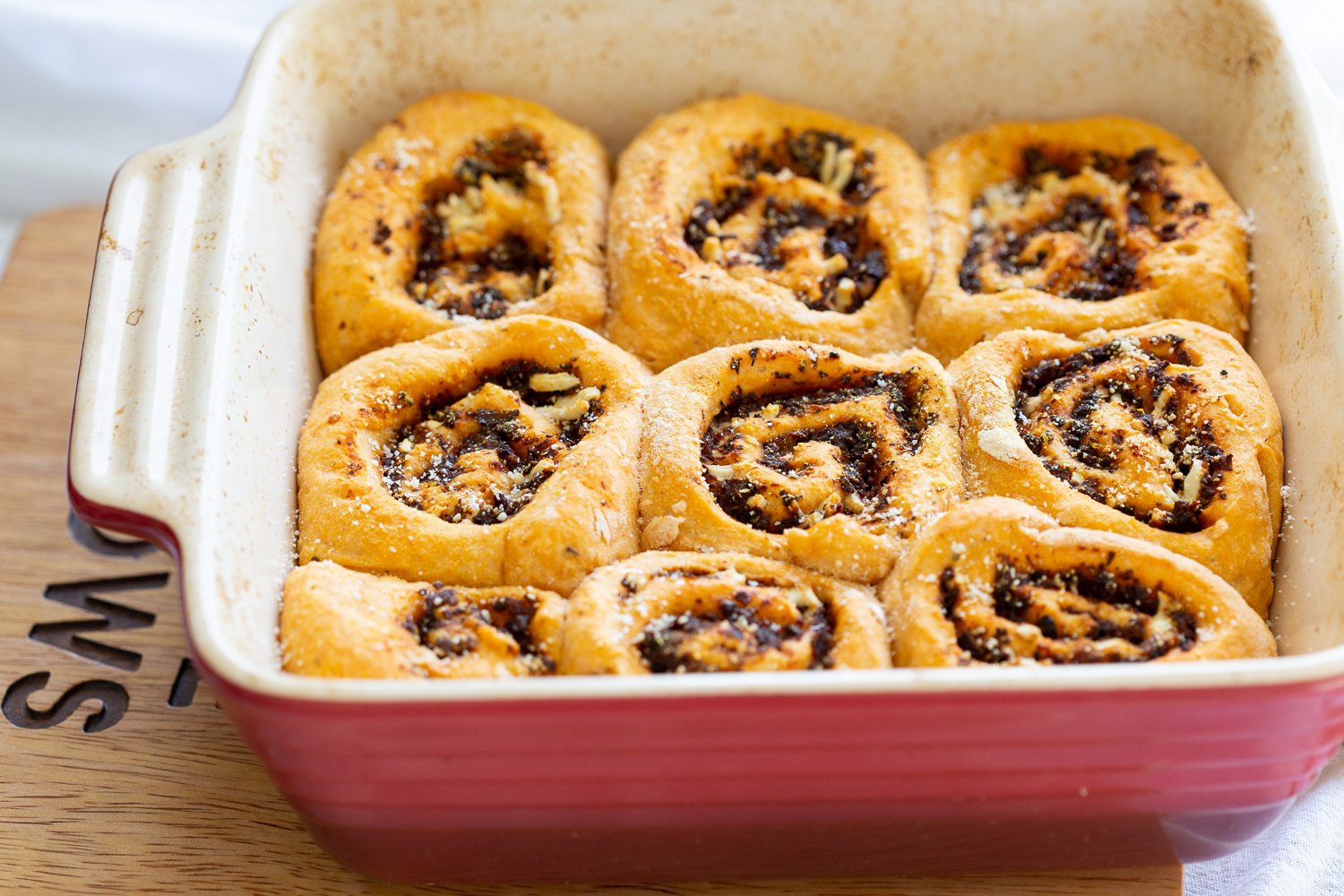 Vegan Pizza Rolls in a ceramic baking dish