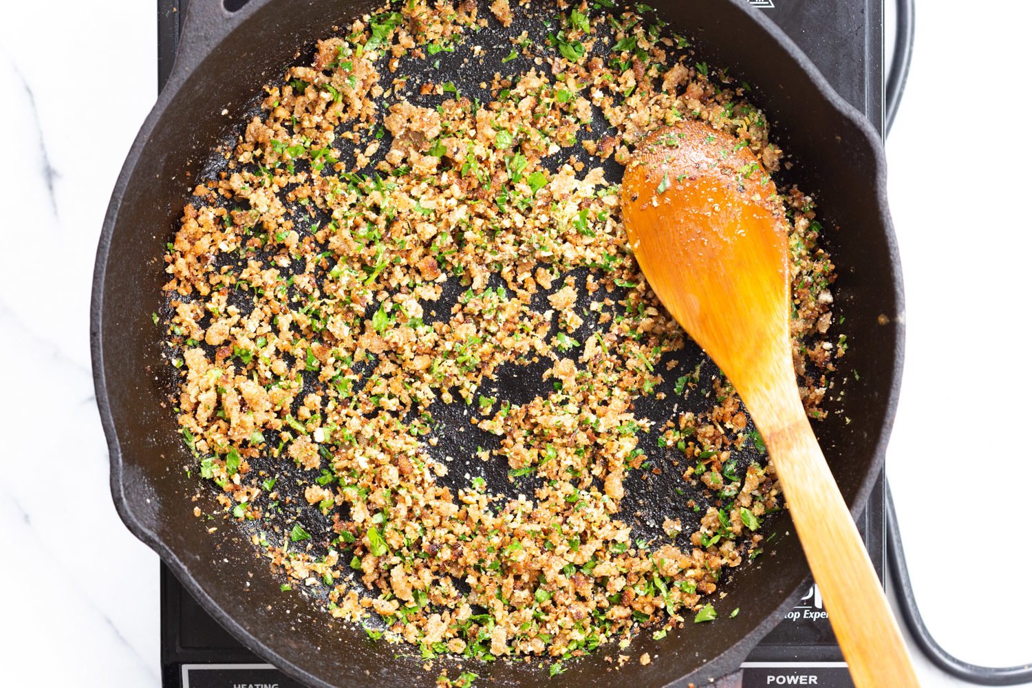Toasted garlic breadcrumbs in cast iron skillet for our Spaghetti with toasted garlic breadcrumbs