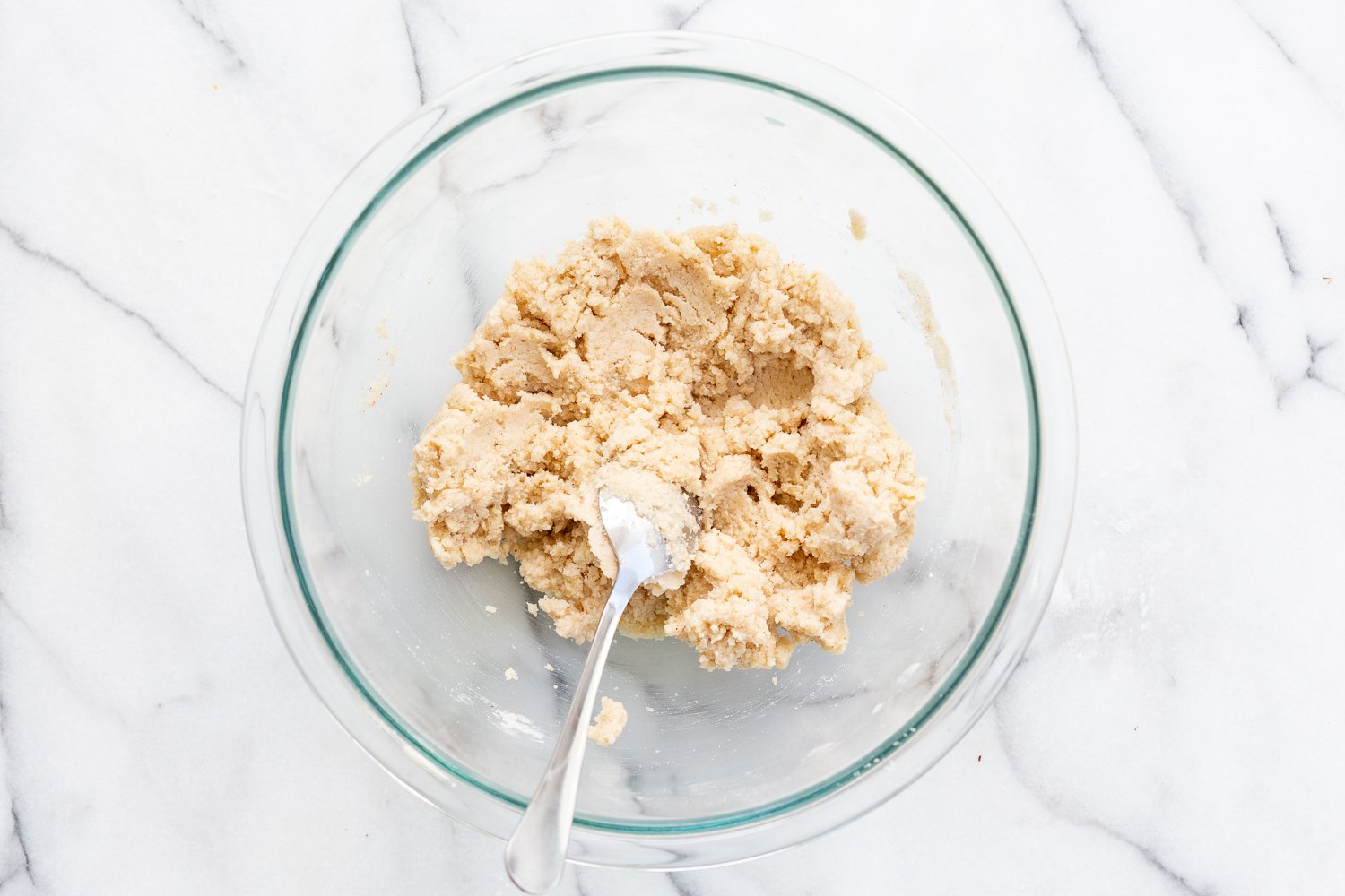 Dough of our Vegan Gluten free Cinnamon Rolls in a glass bowl