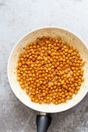 Shawarma Spiced Chickpeas in a white skillet for our Vegan Mediterranean Nachos