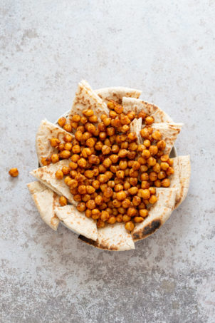 Pita bread, shawarma chickpeas plated for our Mediterranean Nachos.