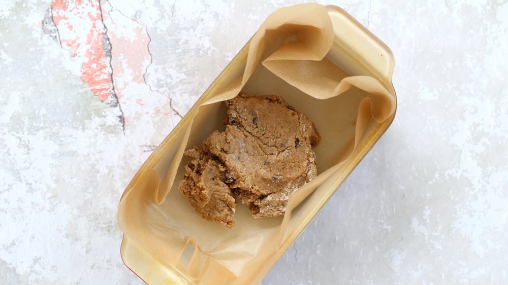 Cookie Dough in a parchment lined loaf pan for our Vegan Cookie Dough Ice Cream Sandwiches