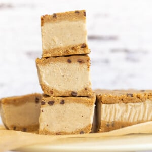 These Vegan Cookie Dough Ice Cream Sandwiches use a quick oat flour cookie dough with coconut milk vanilla ice cream base all homemade. No Baking, no ice cream machine needed. Glutenfree Soyfree Recipe. 