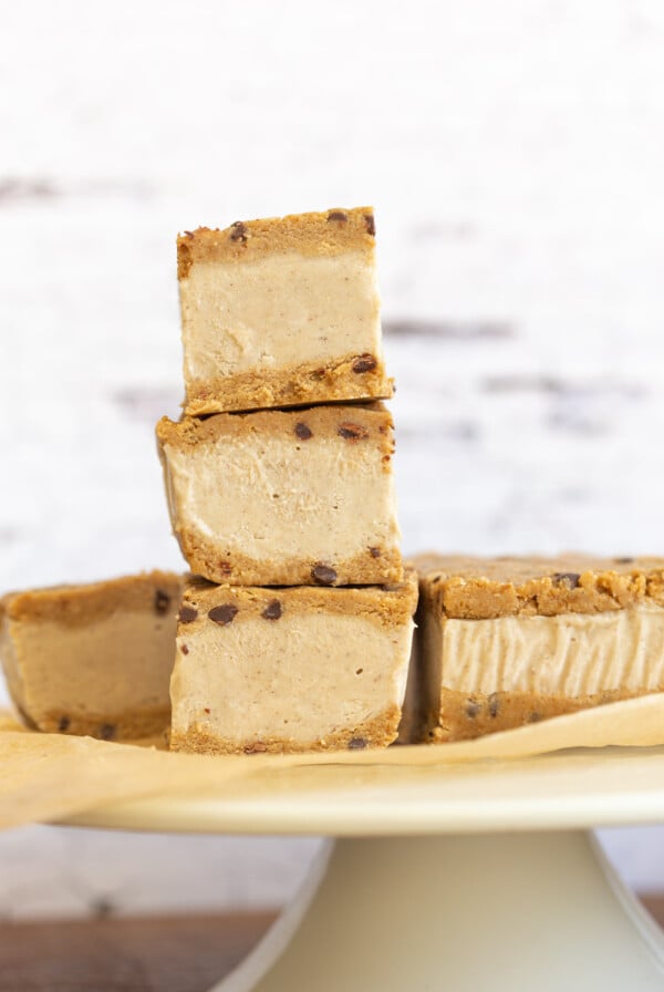 These Vegan Cookie Dough Ice Cream Sandwiches use a quick oat flour cookie dough with coconut milk vanilla ice cream base all homemade. No Baking, no ice cream machine needed. Glutenfree Soyfree Recipe. 