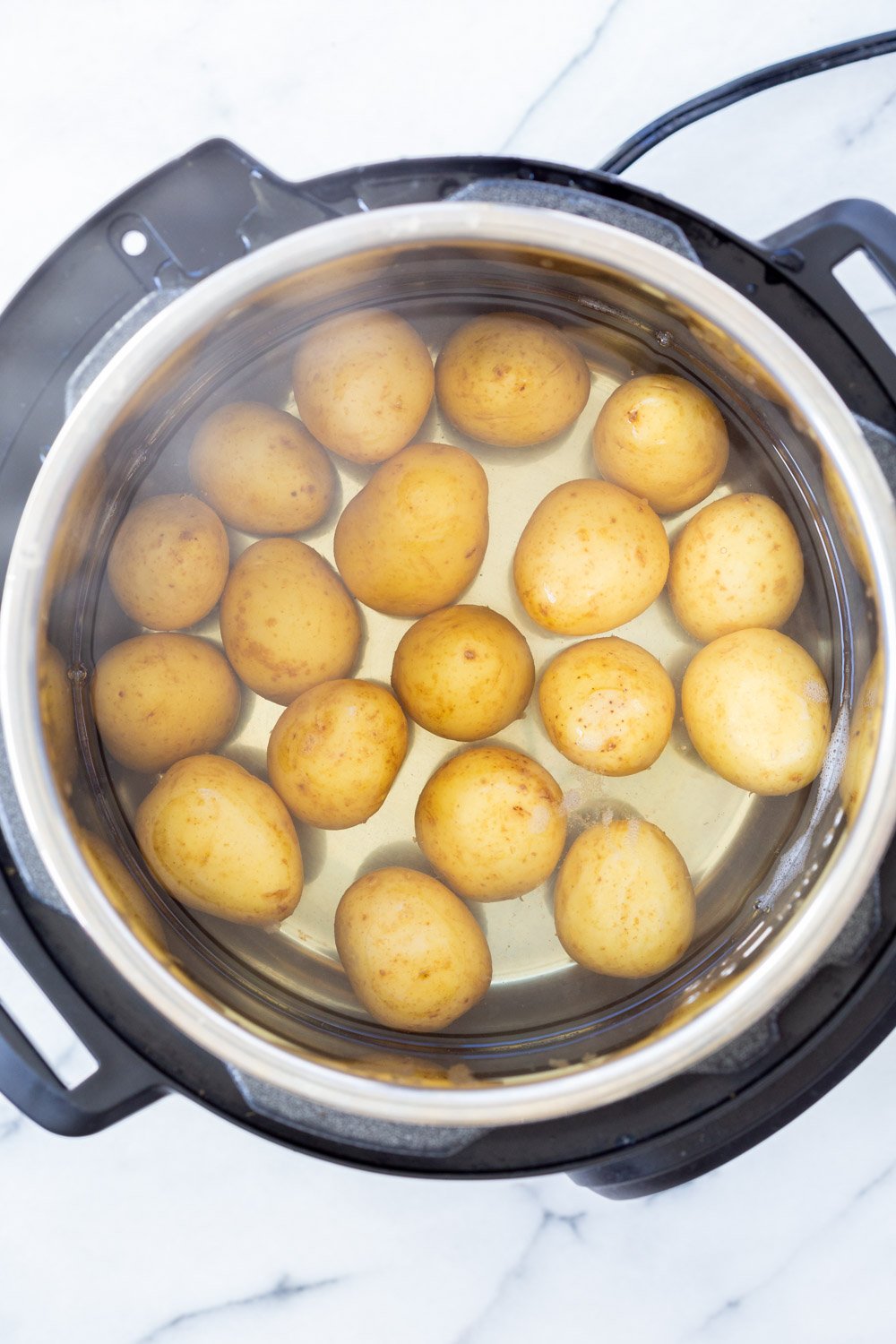Potatoes cooked in Instant Pot for our Crispy Vegan Smashed Potatoes with Chimichurri. #vegansmashedpotatoes #VeganRicha