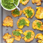 Crispy Vegan Smashed Potatoes with Chimichurri. These Smashed potatoes are baked to a crisp and served with fresh homemade parsley chimichurri. #VeganRicha #VeganSmashedPotatoes #Vegan #Glutenfree #Nutfree #Soyfree #Recipe