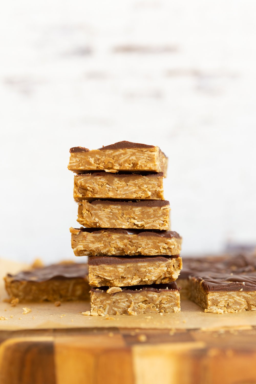 Sliced Sunbutter Granola Bars stacked on wood board