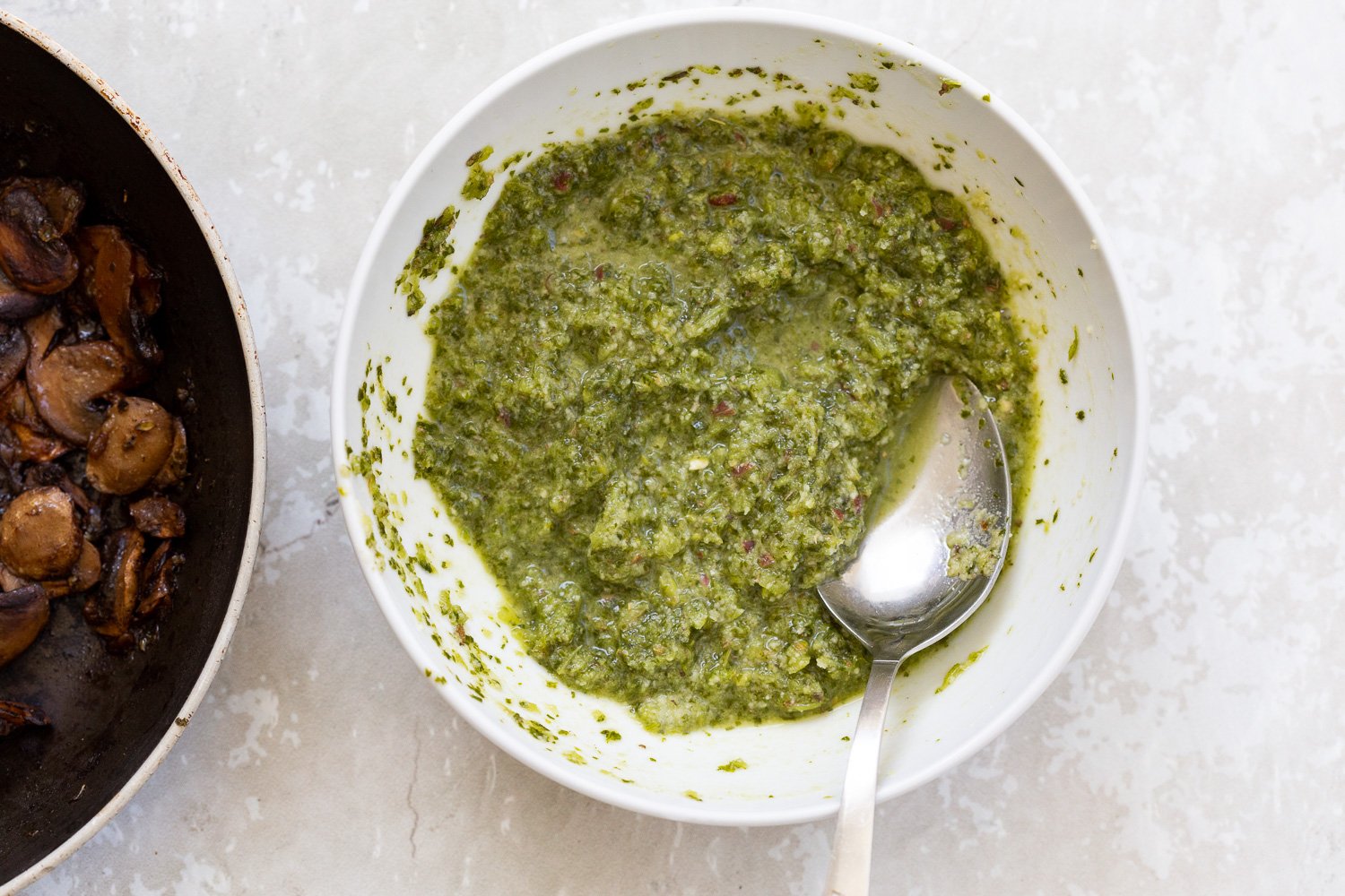 pizza rolls recipe  vegan pesto in a small white bowl