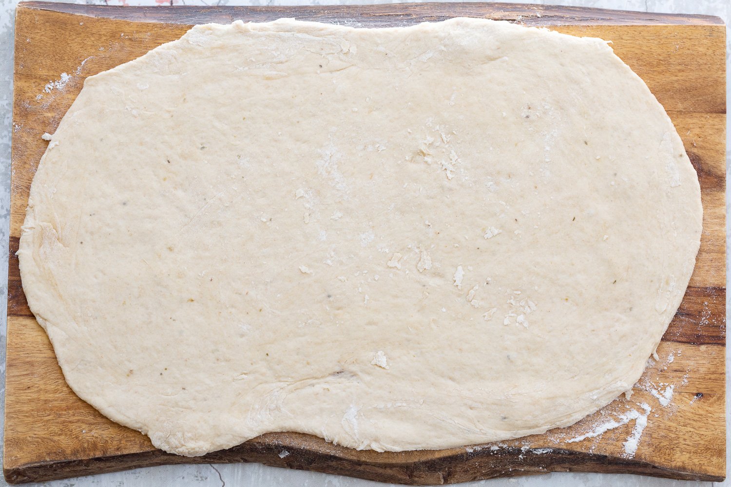 pizza rolls recipe Vegan Pizza rolls dough being rolled out into a rectangle