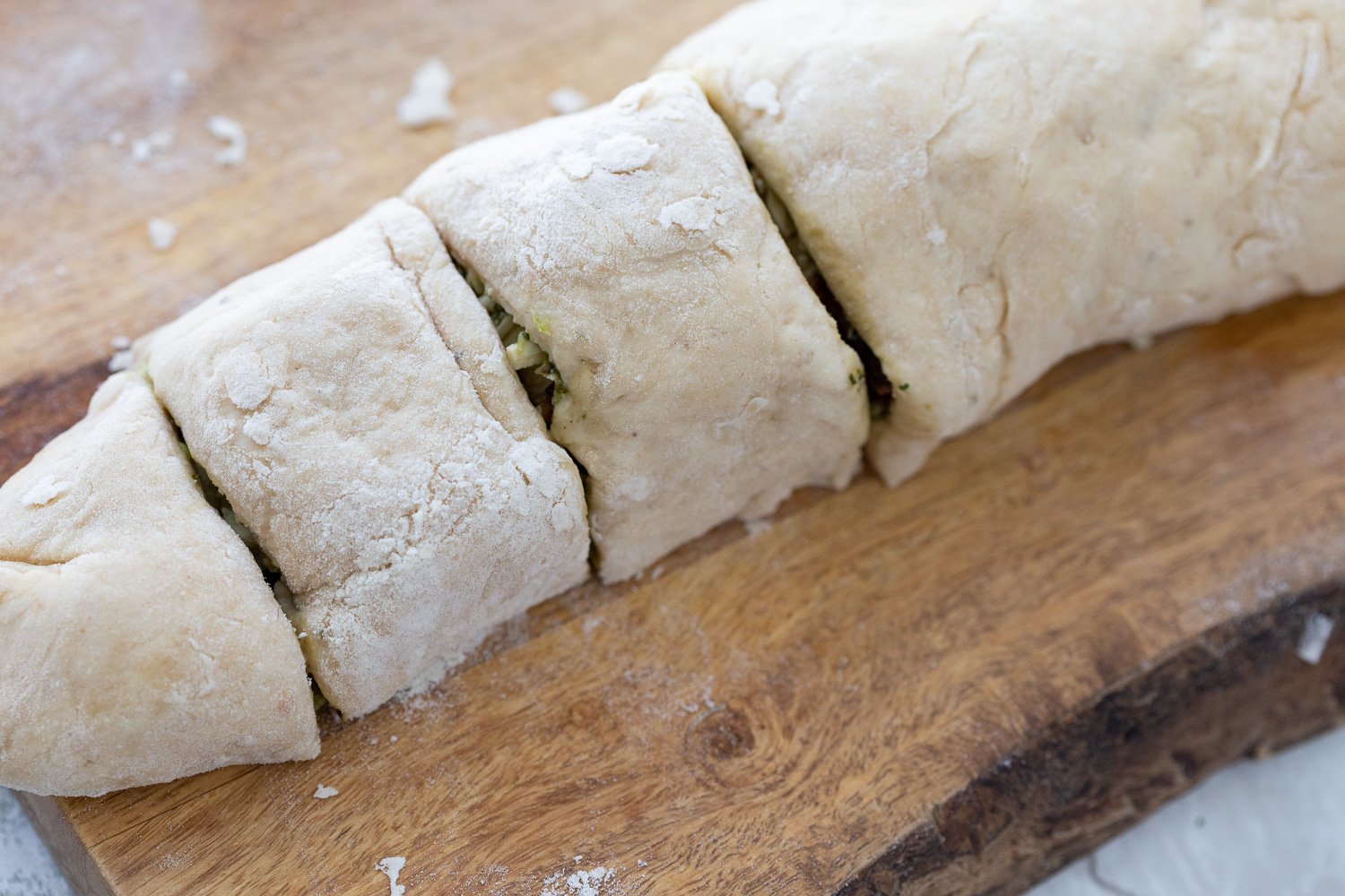 pizza rolls recipe Pesto Pizza rolls on a cutting board