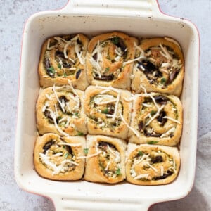 overhead shot of Pesto Pizza rolls in a white casserole dish